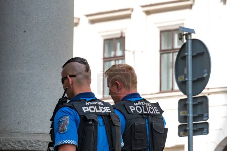 Photo for Prague, Czech Republic - July 25, 2020: Two back turned Czech police officers - Royalty Free Image