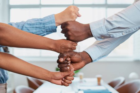 Photo for Diverse stacked fists together in teamwork tower, corporate business boardroom. High quality photo - Royalty Free Image