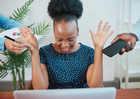 Young Black woman screams at work when deadline pressure builds up. High quality photo
