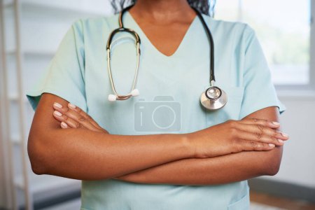 Photo for Cropped close up of doctors arms folded holding stethoscope modern office. High quality photo - Royalty Free Image