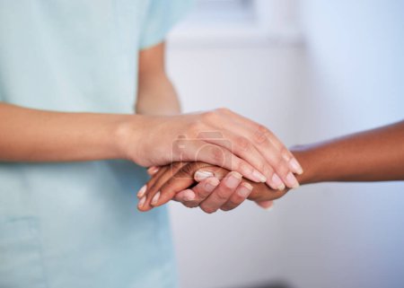 Photo for Close up of nurse holding patients hand during difficult diagnosis, counselling. High quality photo - Royalty Free Image
