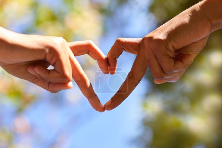 Two women make heart shape with their hands, fingers - Earth Day, love nature. High quality photo