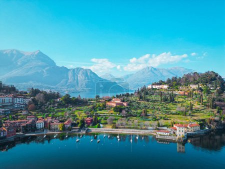 Photo for Aerial view of Bellagio in lake Como, a picturesque and traditional village in Lombardy, Italy. High top view to water landscape with green hills, mountains in summer. Drone lake Como. - Royalty Free Image
