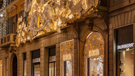 Photo for MILAN, ITALY December 4, 2023 A Dior store at the street Monte Napoleone. Christmas Street Decorated for Christmas. Fashion district. High quality photo - Royalty Free Image