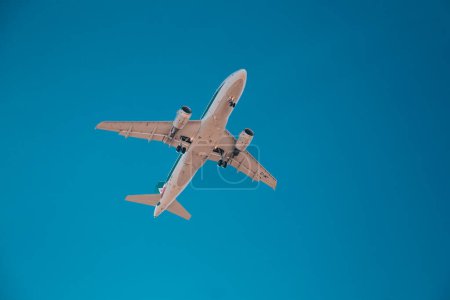Photo for Milan, Italy 6.12.2023. Airplane in the sky, Passenger Airliner. Airplane flying on blue sky. - Royalty Free Image