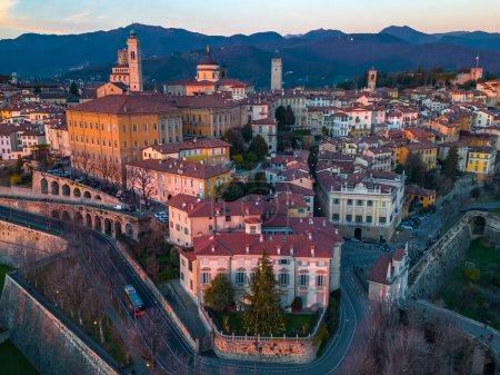Photo for Bergamo, Italy. Drone aerial view of the old town during sunrise. Landscape at the city center, its historical buildings. Citta Alta - Bergamo. - Royalty Free Image