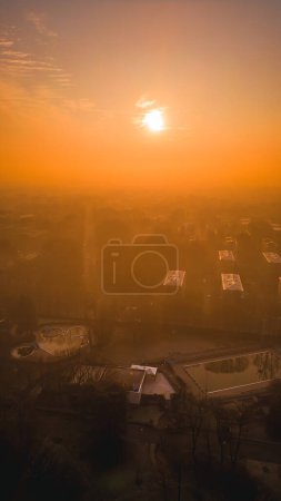 Foggy sunrise with San Donato Milanese Skyline from a drone, Lombardia, Milano, Italia 5.02.2024. High quality photo