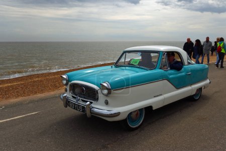 Photo for FELIXSTOWE, SUFFOLK, ENGLAND - MAY 01, 2022: Classic Blue and White Nash  Metropolitan Motor  Car on Seafront Promenade. - Royalty Free Image