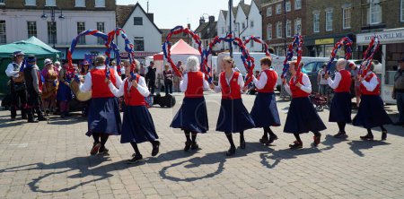 Photo for ST NEOTS, CAMBRIDGESHIRE, ENGLAND -  JUNE 10, 2023: Lady Morris Dancers performing on town square - Royalty Free Image