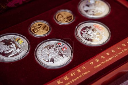 Photo for 03/11/2023. Lvov, Ukraine. gold and silver coins from the Olyspian games in Beijing, China. - Royalty Free Image