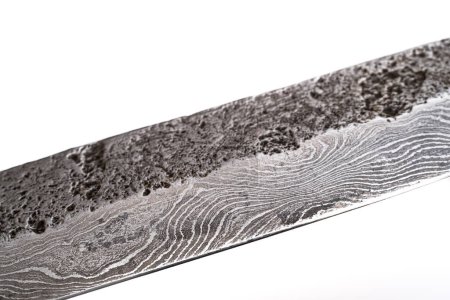 Hintergrund ist ein Muster aus Damaskus-Stahl. Makroaufnahme der Textur des Damascusmessers. Damaskusstahl mit Originalmuster. Damaskusstahlmuster.
