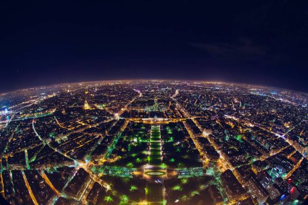aerial view of illuminated night city panorama of Paris with street lights, drone top view from above, Champs Elysees and Elysee Palace, France. High quality photo