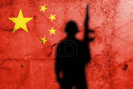 Photo for Flag of China painted on a concrete wall with soldier shadow - Royalty Free Image