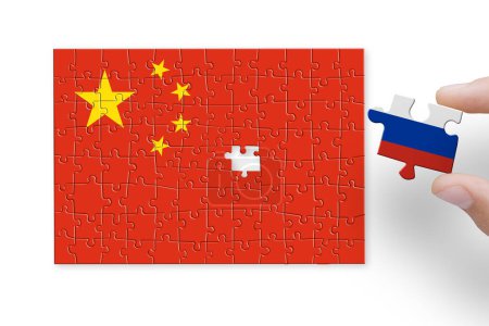 Photo for Puzzle made from China and Russia flags. Sanctions and embargo for Russian war and aggression in Ukraine - Royalty Free Image