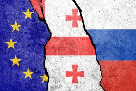 Flagge der EU, Georgiens und Russlands an Betonwand gemalt 