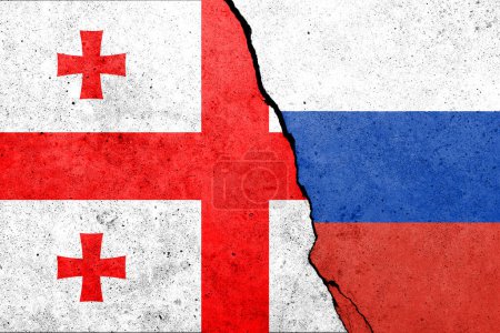 Flagge Georgiens und Russlands an Betonwand gemalt 