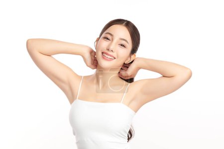 Photo for Beautiful Young Asian woman lifting hands up to show off clean and hygienic armpits or underarms on white background, Smooth armpit cleanliness and protection concept - Royalty Free Image
