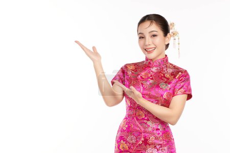 Photo for Asian chinese woman in traditional cheongsam qipao dress on white background. Chinese new year festival, - Royalty Free Image