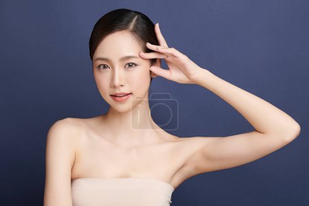 Photo for Beautiful young asian woman with clean fresh skin on blue background, Face care, Facial treatment, Cosmetology, beauty and spa, Asian women portrait. - Royalty Free Image