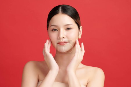 Photo for Beautiful young asian woman with clean fresh skin on red background, Face care, Facial treatment, Cosmetology, beauty and spa, Asian women portrait. - Royalty Free Image