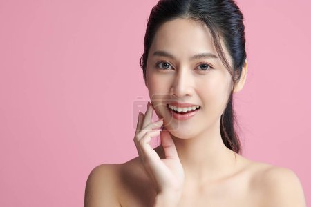 Photo for Beautiful young asian woman with clean fresh skin on pink background, Face care, Facial treatment, Cosmetology, beauty and spa, Asian women portrait. - Royalty Free Image