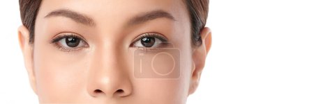 Foto de Close-up shot of beautiful Asian woman's eyes on white background. - Imagen libre de derechos