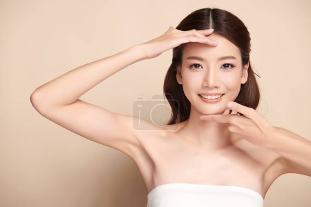 Photo for Beautiful young asian woman with clean fresh skin on beige background, Face care, Facial treatment, Cosmetology, beauty and spa, Asian women portrait. - Royalty Free Image