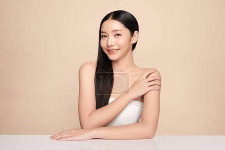 Photo for Beautiful young asian woman with clean fresh skin on beige background, Face care, Facial treatment, Cosmetology, beauty and spa, Asian women portrait. - Royalty Free Image