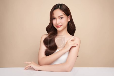 Photo for Beautiful young woman with clean fresh skin on beige background, Face care, Facial treatment, Cosmetology, beauty and spa, women portrait. - Royalty Free Image