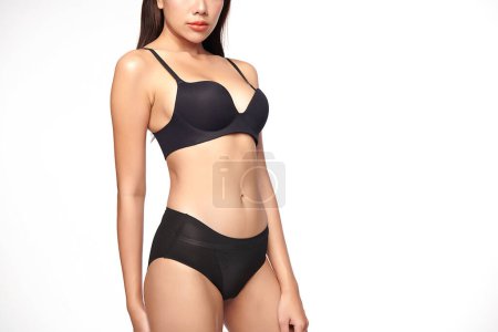 Photo for Confident beautiful young asian woman posing in black lingerie on white background, Perfect body, - Royalty Free Image