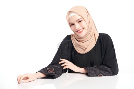 Photo for Beautiful young asian muslim woman wearing a beige hijab on white background, Portrait of Arab Beauty. - Royalty Free Image