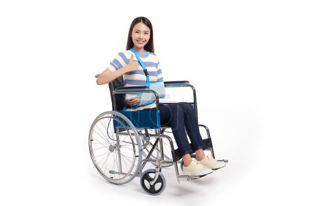 Photo for Beautiful young asian with happy smiling woman in a wheelchair on white background, healthcare concept, accident, insurance, life insurance, wellness, hospital. - Royalty Free Image