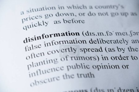 Photo for A mock up of a dictionary page with the word Disinformation with selective focussing - Royalty Free Image