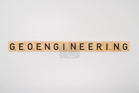 Photo for Wooden title spelling the word geoengineering isolated on a white background - Royalty Free Image