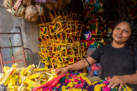 Photo for Latina woman seller of traditional Masaya crafts, used for the celebration of la purisima or shouting in Nicaragua - Royalty Free Image
