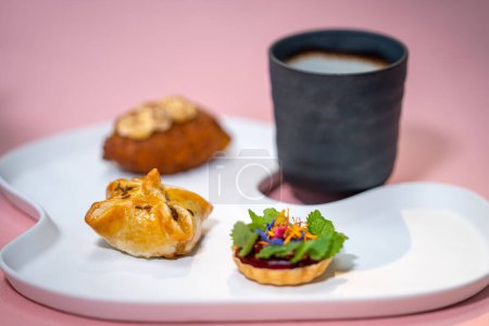Foto de Restaurant food. Restaurant dish. Onion patty, goat cheese, potato donut, boletus broth. - Imagen libre de derechos