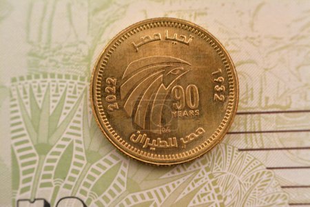 Photo for Cairo, Egypt, July 24 2022: Obverse side of 50 fifty Egyptian piasters commemorative coin features eagle head and Arabic text, Translation (Long live Egypt , EgyptAir) 90 years of Egypt Air Company - Royalty Free Image