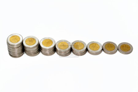 Photo for Stacks of 1 LE EGP one Egyptian pound coins cash isolated on white background, Egypt currency exchange rate concept with foreign currencies, selective focus of Egypt coinage - Royalty Free Image