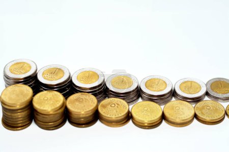 Photo for Stacks of 1 LE EGP one Egyptian pound coins cash and 50 fifty Egyptian piasters half a pound coins isolated on white background, Egypt currency exchange rate concept, selective focus - Royalty Free Image