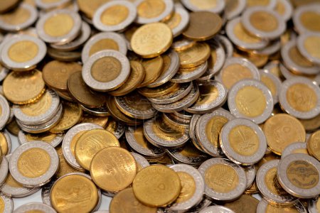 Photo for Large amount of Egyptian coins, Piles of 1 EGP LE one Egyptian pound and half a pound 50 fifty piasters, stacks of Egypt currency background, economy and money exchange rate concept, selective focus - Royalty Free Image