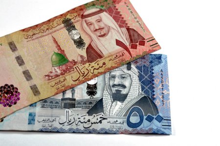 Photo for 500 SAR Five hundred Saudi Arabia riyals cash money with king AbdulAziz Al Saud and Kabaa and 100 SAR one hundred Saudi Arabia riyals banknote with king Salman and Prophet mosque in Medina isolated - Royalty Free Image