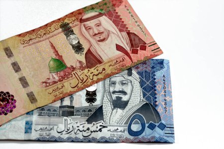 Photo for 500 SAR Five hundred Saudi Arabia riyals cash money with king AbdulAziz Al Saud and Kabaa and 100 SAR one hundred Saudi Arabia riyals banknote with king Salman and Prophet mosque in Medina isolated - Royalty Free Image