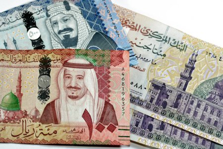 Photo for Collection of 500, 100 SAR Five hundred and one hundred Saudi Arabia riyals cash money banknotes with 200 LE EGP two hundred Egyptian money pounds isolated on white background, money exchange rate - Royalty Free Image