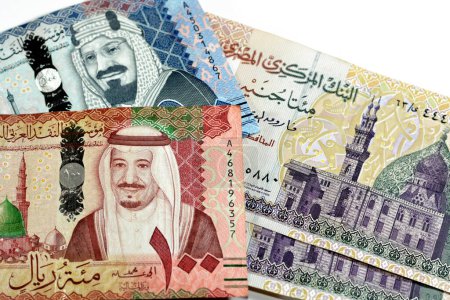 Photo for Collection of 500, 100 SAR Five hundred and one hundred Saudi Arabia riyals cash money banknotes with 200 LE EGP two hundred Egyptian money pounds isolated on white background, money exchange rate - Royalty Free Image