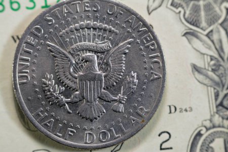 Seal of the President of the United States surrounded by 50 stars from the reverse side of Kennedy half dollar 50 cent coin series 1973 as a memorial to the assassinated 35th president of USA