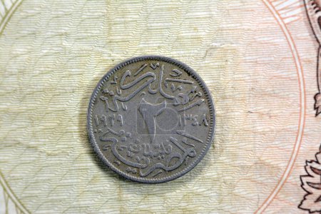 Photo for Round old Egyptian coin of two 2 milliemes series 1929 AD 1348 AH features king Fuad I of Egypt on obverse side and value with date on the reverse side, vintage retro old Egyptian coin - Royalty Free Image