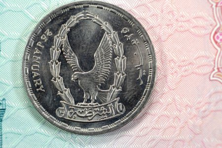 Photo for Twenty Egyptian piasters commemorative issue of Egypt police day of January 25 1952 series 1988 AD, 1408 AH with a flaying falcon on obverse side, date, value and Arab Republic of Egypt on reverse - Royalty Free Image