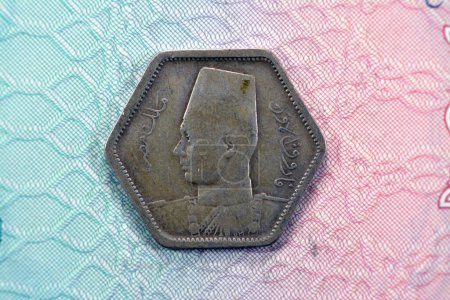 Photo for Ancient hexagon old two 2 piasters coin at the era of king Farouk I features value and kingdom of Egypt on a side and a bust of King Farouk the 1st on the other side, vintage retro coin - Royalty Free Image