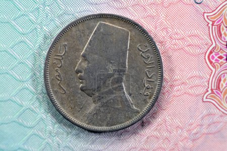 Photo for Vintage retro old and ancient historic 10 Ten Egyptian milliemes coin series 1929 AD 1348 AH features bust of king Fuad I of Egypt on obverse side and value and date on reverse side, old coin - Royalty Free Image
