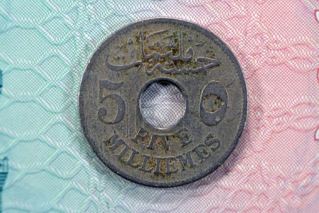 Photo for Historic ancient vintage retro old Egyptian 5 milliemes at the Era of Sultan king Hussien Kamel series 1917 AD 1335 AH features value in Arabic and English on a side and Date king name on other side - Royalty Free Image